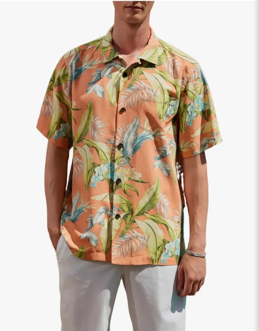 Coral LUXSTITCH shirt with layered green and blue tropical leaves